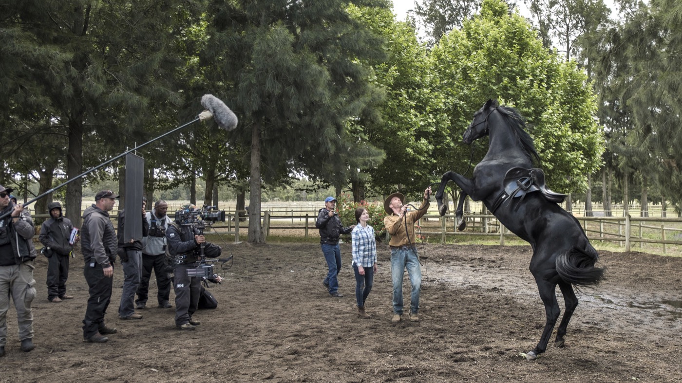 The Black Beauty cast, equine team, and camera crew filming with Beauty